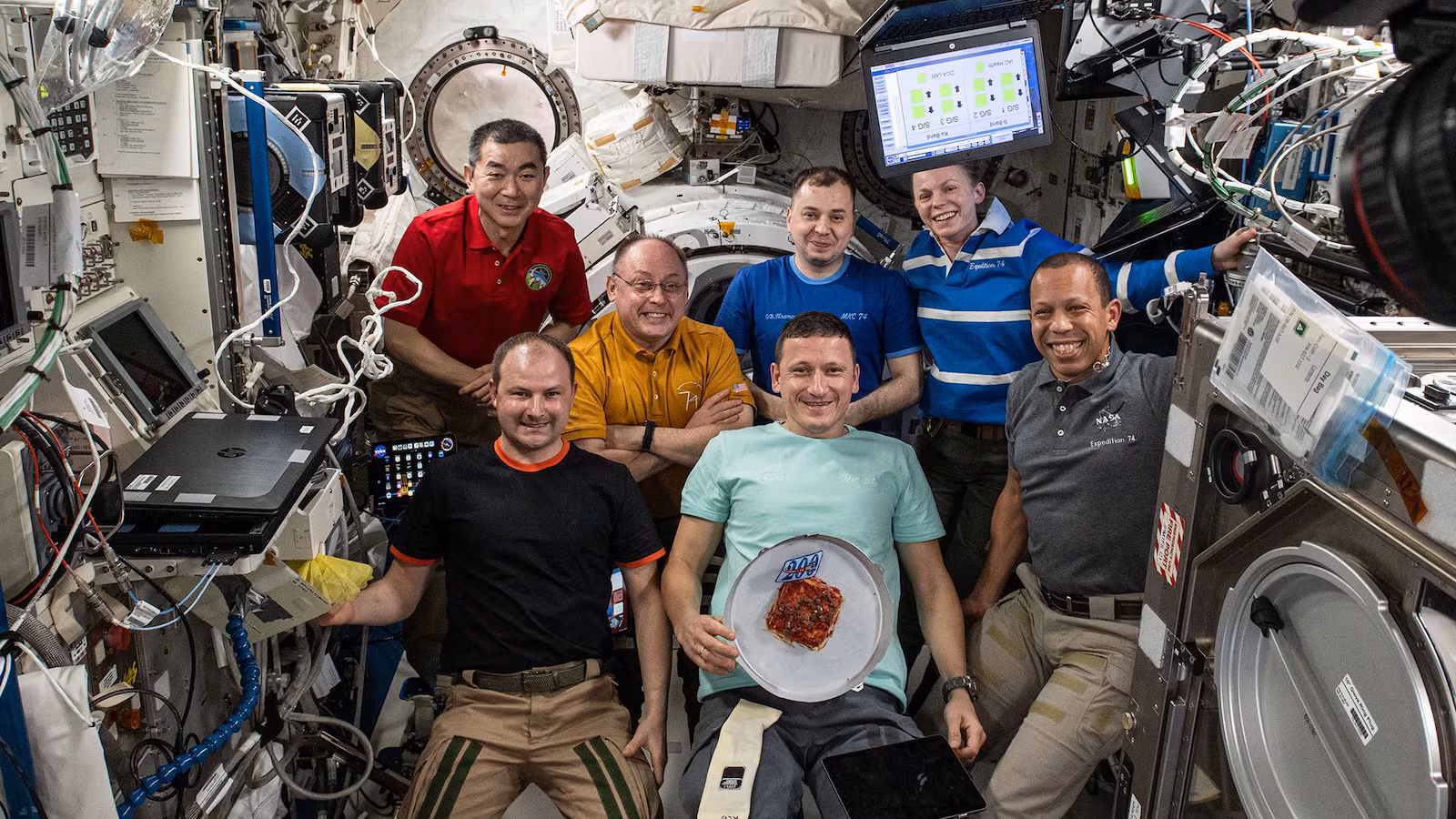 Expedition 74 crew poses for portrait aboard space station