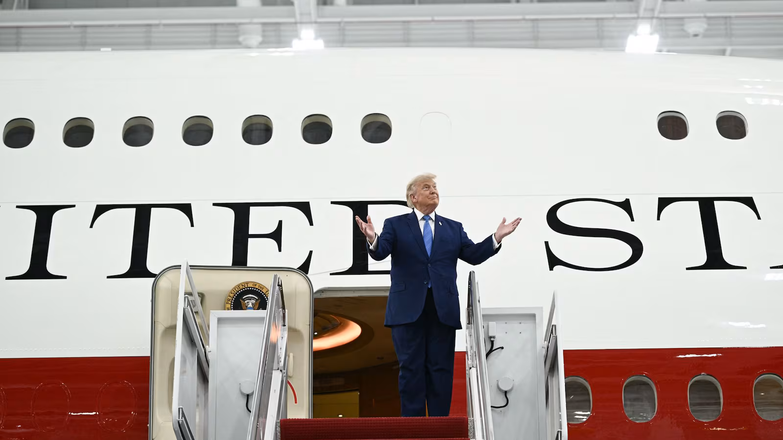 Trump boarding the Qatari Air Force One jet
