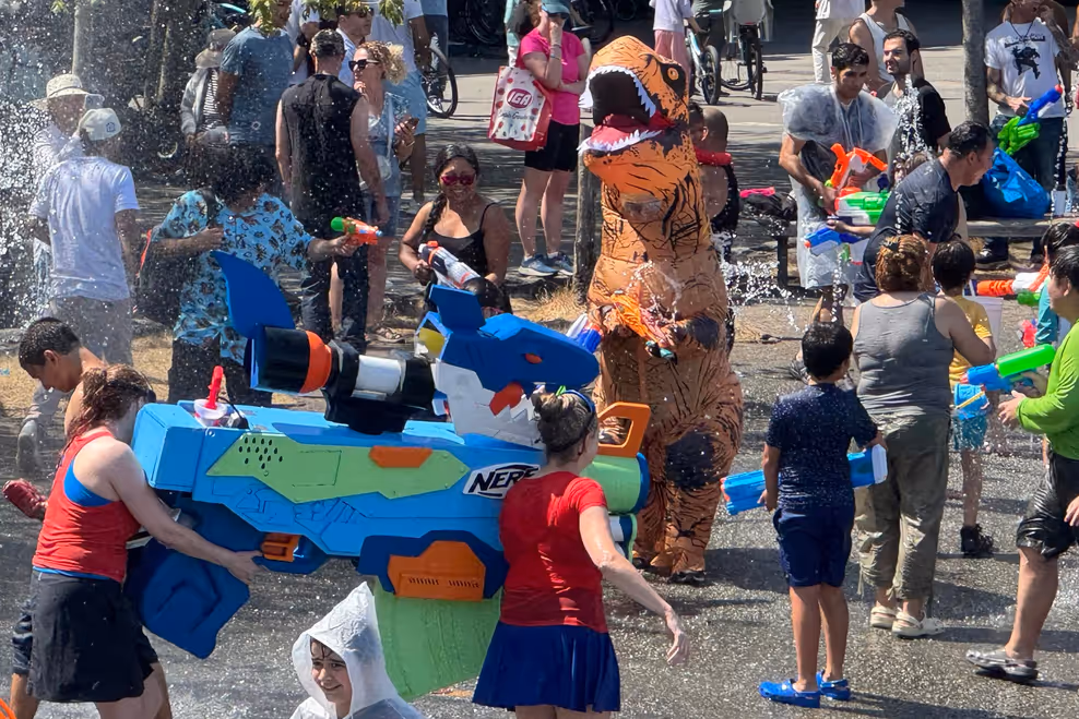 Vancouver Water Fight participants spraying water guns at Stanley Park