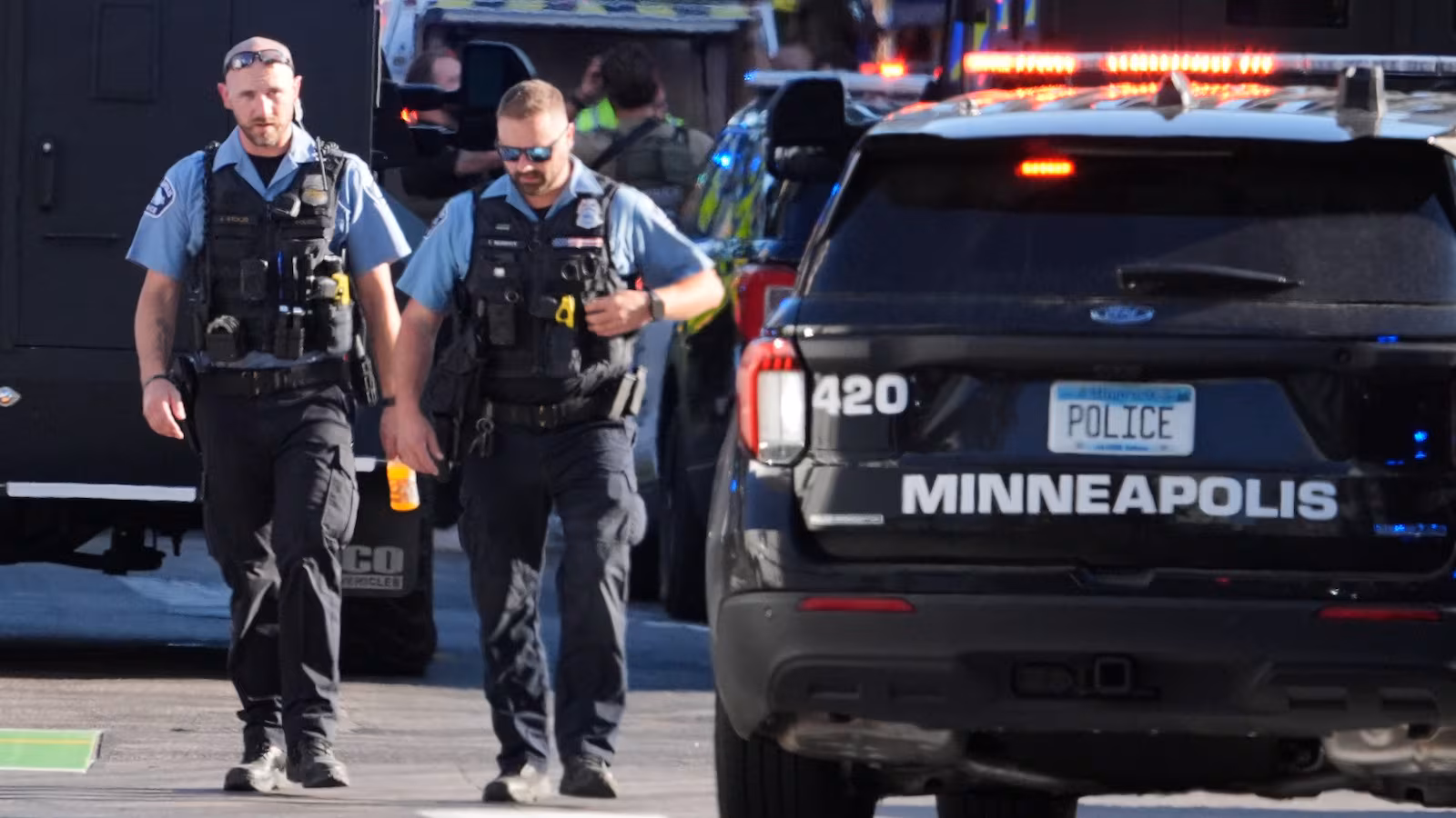 "downtown Minneapolis shooting scene with police officers responding"
